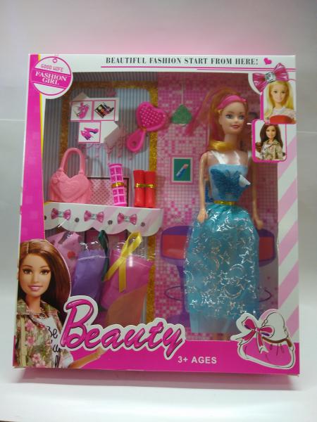 MUÑECA +3 VESTIDOS ZAPATOS/RULERO 29X28CM